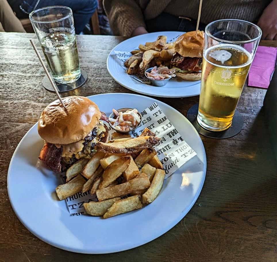 Two bacon double cheese burgers and wedges at The Stags Head